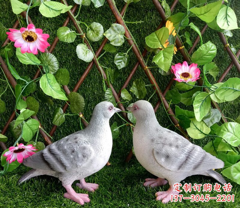 河南雕塑小女孩一只手拿书一手和平鸽